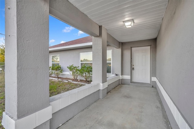 view of exterior entry featuring stucco siding