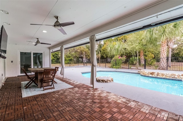 view of pool featuring a patio area, a fenced in pool, a fenced backyard, and ceiling fan