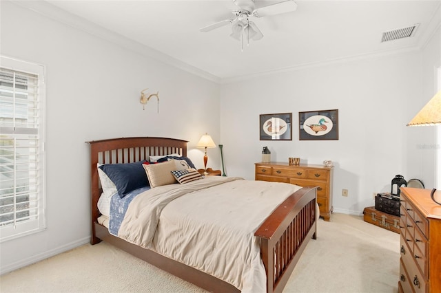 bedroom with light carpet, baseboards, visible vents, and crown molding