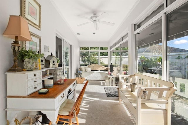 sunroom with a ceiling fan, a healthy amount of sunlight, and visible vents