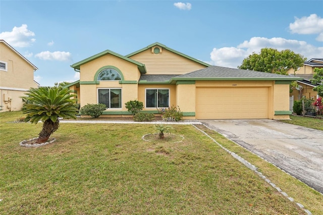 view of front of house featuring stucco siding, a front lawn, driveway, roof with shingles, and an attached garage