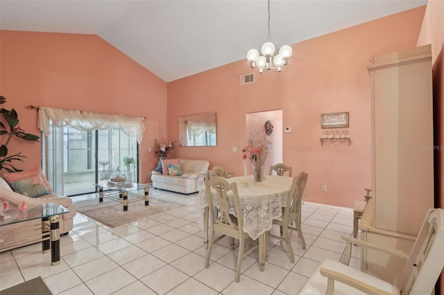 dining area featuring light tile patterned floors, visible vents, high vaulted ceiling, and a chandelier