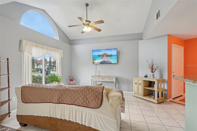 living room featuring visible vents, a textured ceiling, light tile patterned flooring, lofted ceiling, and ceiling fan