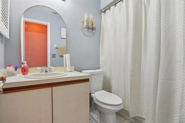 full bath featuring tile patterned floors, toilet, and vanity