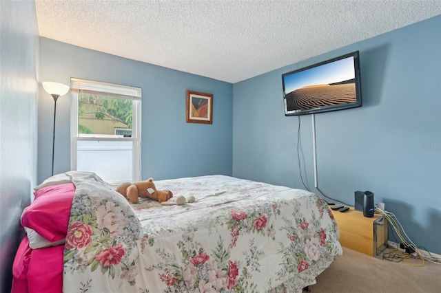 bedroom with carpet flooring and a textured ceiling