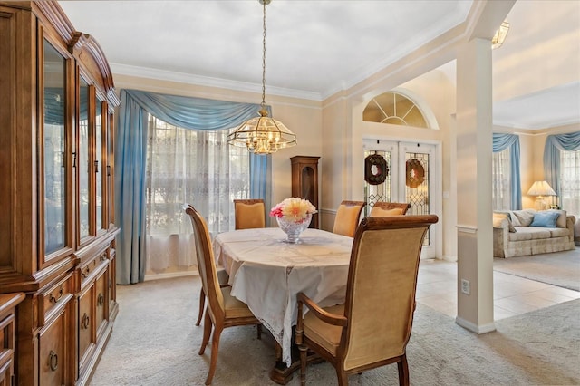 8606 Terrace Pines Ct, Orlando, FL 32836 - dining space featuring ornamental molding, a chandelier, light colored carpet, and light tile patterned floors