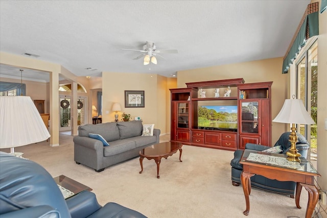 8606 Terrace Pines Ct, Orlando, FL 32836 - carpeted living area featuring a textured ceiling, visible vents, a ceiling fan, and french doors