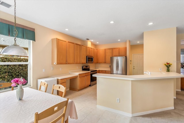 8606 Terrace Pines Ct, Orlando, FL 32836 - kitchen featuring visible vents, appliances with stainless steel finishes, a peninsula, light countertops, and recessed lighting