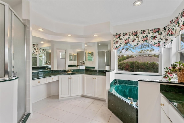 8606 Terrace Pines Ct, Orlando, FL 32836 - bathroom with a garden tub, recessed lighting, vanity, tile patterned floors, and a stall shower