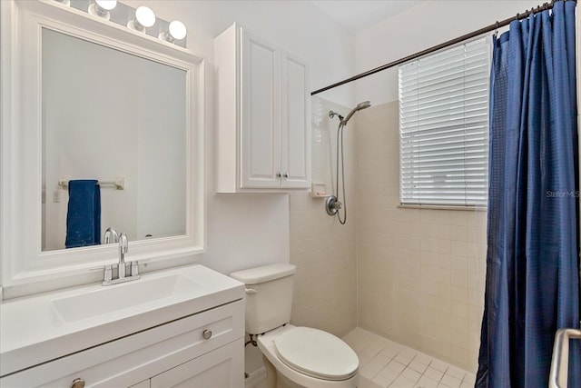 8606 Terrace Pines Ct, Orlando, FL 32836 - bathroom with a tile shower, vanity, and toilet