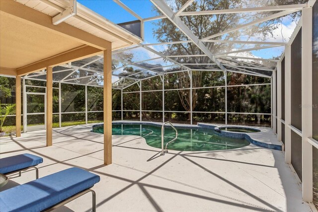 8606 Terrace Pines Ct, Orlando, FL 32836 - view of pool featuring a lanai, a pool with connected hot tub, and a patio