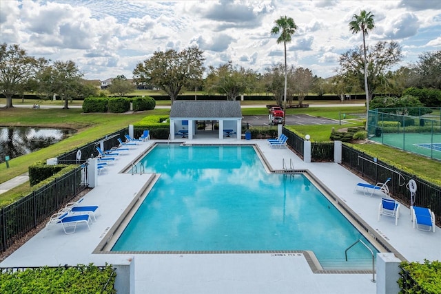 8606 Terrace Pines Ct, Orlando, FL 32836 - community pool with a patio area and fence