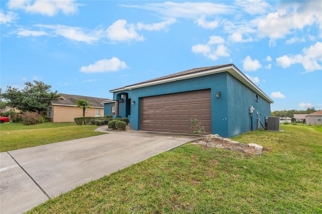 2851 Stonewood Cir, Lakeland, FL 33810 - view of front of house featuring driveway, an attached garage, a front lawn, central AC, and stucco siding