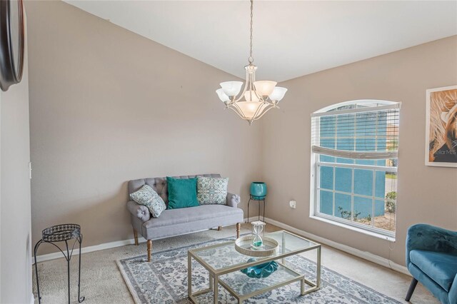 2851 Stonewood Cir, Lakeland, FL 33810 - carpeted living area with a chandelier and baseboards