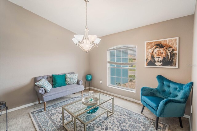 2851 Stonewood Cir, Lakeland, FL 33810 - carpeted living area with a notable chandelier and baseboards