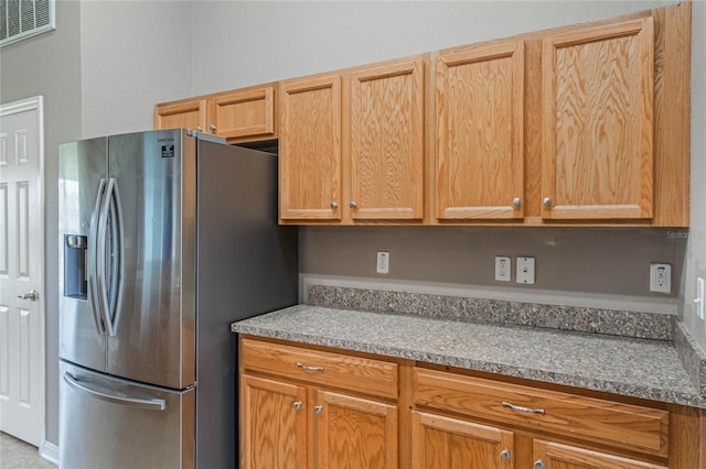 2851 Stonewood Cir, Lakeland, FL 33810 - kitchen featuring stainless steel fridge and visible vents