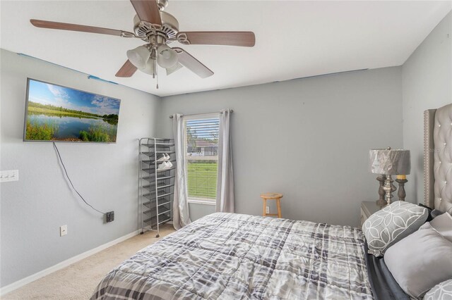 2851 Stonewood Cir, Lakeland, FL 33810 - carpeted bedroom with ceiling fan and baseboards
