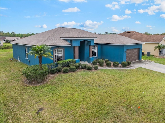 2851 Stonewood Cir, Lakeland, FL 33810 - view of front facade with a front yard, driveway, an attached garage, and stucco siding