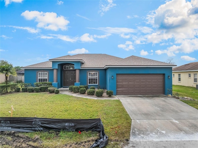 2851 Stonewood Cir, Lakeland, FL 33810 - single story home featuring an attached garage, a front lawn, concrete driveway, and stucco siding