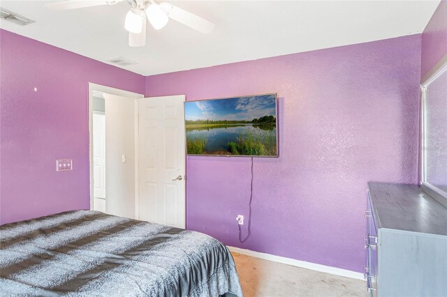 2851 Stonewood Cir, Lakeland, FL 33810 - bedroom featuring ceiling fan, a textured wall, visible vents, and baseboards