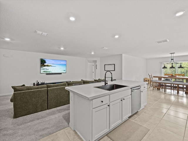 2925 SW 172nd Lane Rd, Ocala, FL 34473 - kitchen with visible vents, an island with sink, a sink, stainless steel dishwasher, and light countertops