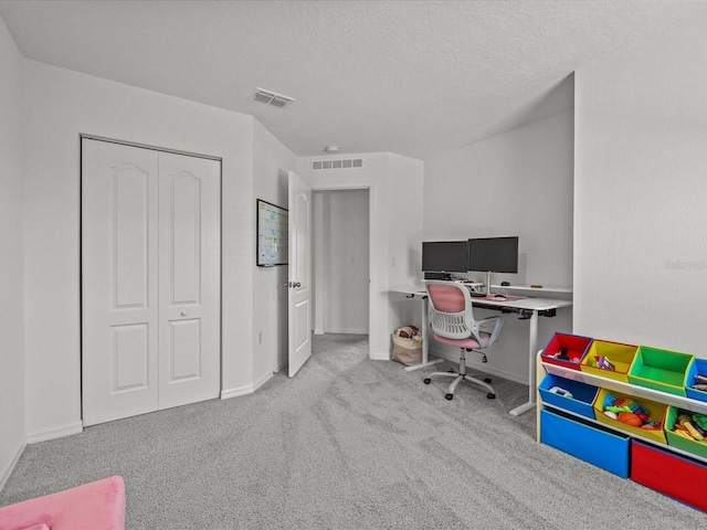 2925 SW 172nd Lane Rd, Ocala, FL 34473 - home office featuring visible vents, a textured ceiling, baseboards, and carpet floors