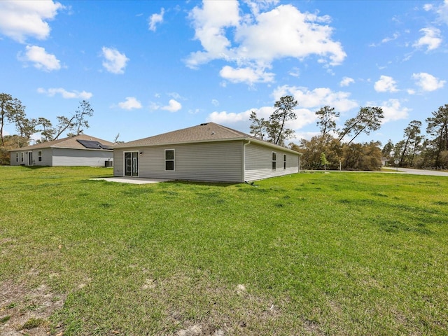 2925 SW 172nd Lane Rd, Ocala, FL 34473 - rear view of house featuring a patio area and a lawn