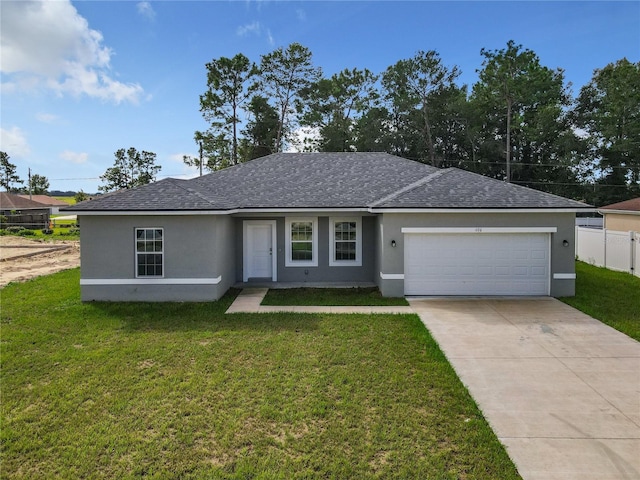 ranch-style house featuring a garage, driveway, a front yard, and stucco siding