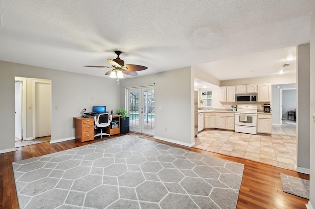 101 Ludlow Dr, Longwood, FL 32779 - office with light wood-style flooring, french doors, baseboards, and a textured ceiling