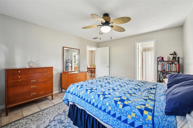 101 Ludlow Dr, Longwood, FL 32779 - bedroom featuring light tile patterned floors, visible vents, a textured ceiling, and ceiling fan