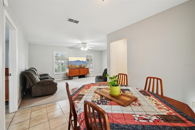 101 Ludlow Dr, Longwood, FL 32779 - dining room featuring visible vents, baseboards, ceiling fan, light colored carpet, and light tile patterned flooring