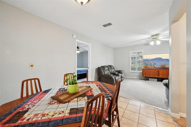 101 Ludlow Dr, Longwood, FL 32779 - dining space with light carpet, light tile patterned flooring, visible vents, and ceiling fan