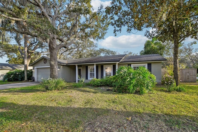 101 Ludlow Dr, Longwood, FL 32779 - ranch-style home featuring a front yard, fence, stucco siding, a garage, and aphalt driveway