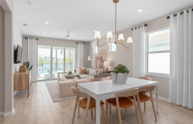 dining room featuring light wood-style floors, recessed lighting, visible vents, and baseboards