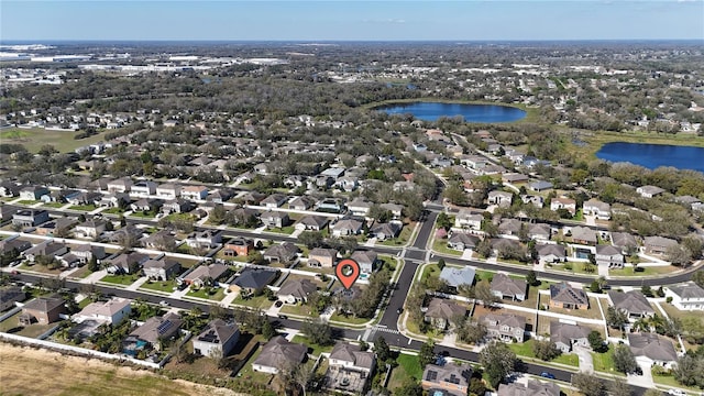 aerial view featuring a water view and a residential view