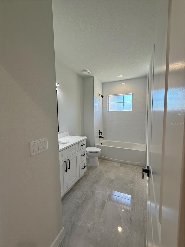 bathroom with visible vents, shower / bath combination, toilet, vanity, and a textured ceiling