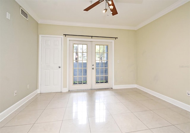 unfurnished room with light tile patterned floors, visible vents, ornamental molding, and french doors