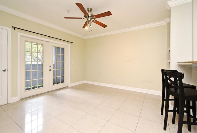 dining space with french doors, crown molding, and light tile patterned floors