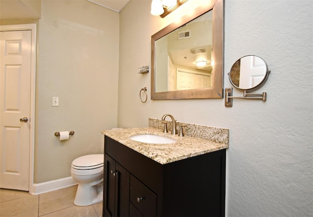 bathroom with toilet, visible vents, baseboards, vanity, and tile patterned floors