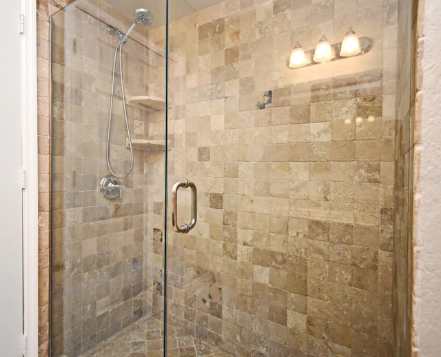 bathroom featuring a shower stall