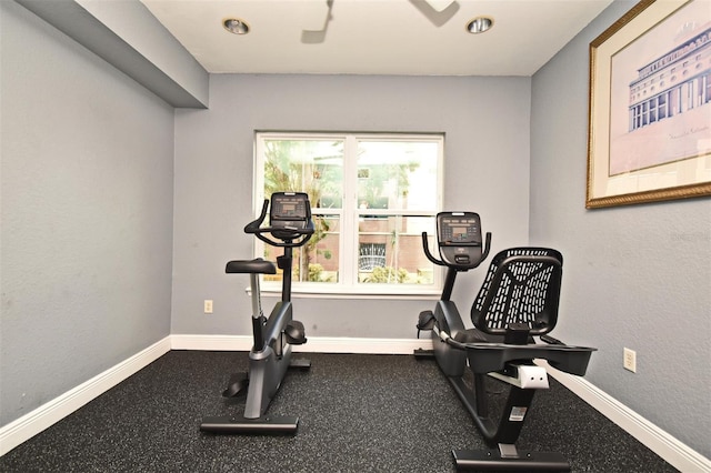 workout room with baseboards