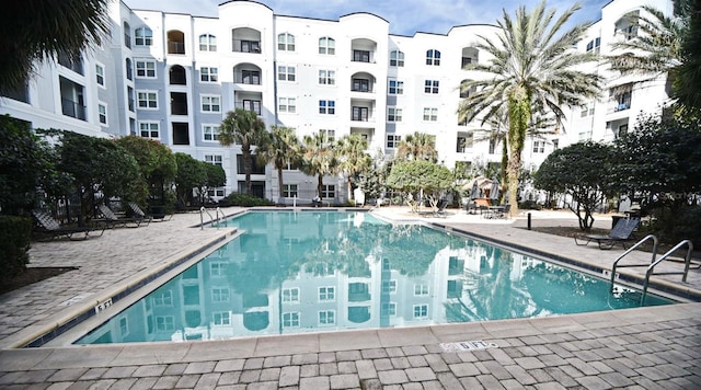 view of swimming pool with a patio area