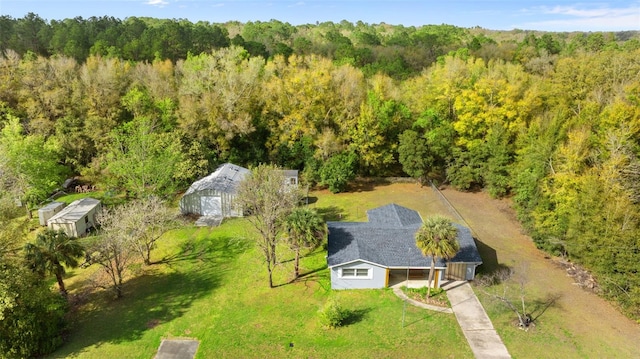 drone / aerial view featuring a forest view