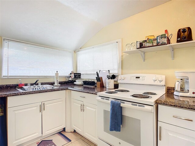 kitchen featuring open shelves, lofted ceiling, electric range, white cabinets, and a sink