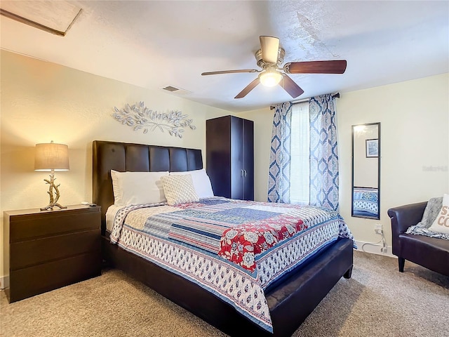 bedroom with light carpet and a ceiling fan