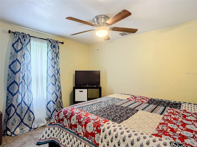 carpeted bedroom featuring a ceiling fan