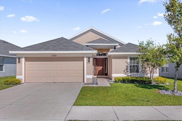 ranch-style home featuring roof with shingles, stucco siding, concrete driveway, an attached garage, and a front lawn