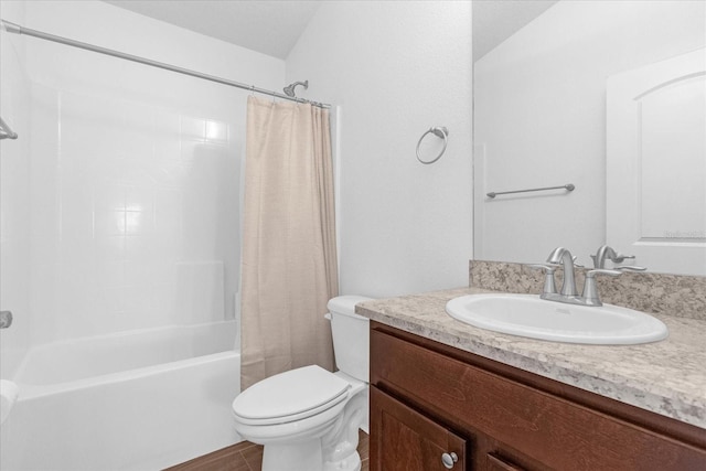 bathroom with shower / tub combo, vanity, and toilet