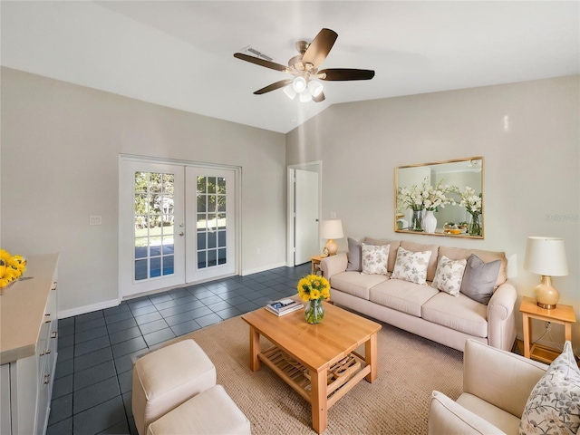 living room with baseboards, dark tile patterned flooring, ceiling fan, vaulted ceiling, and french doors