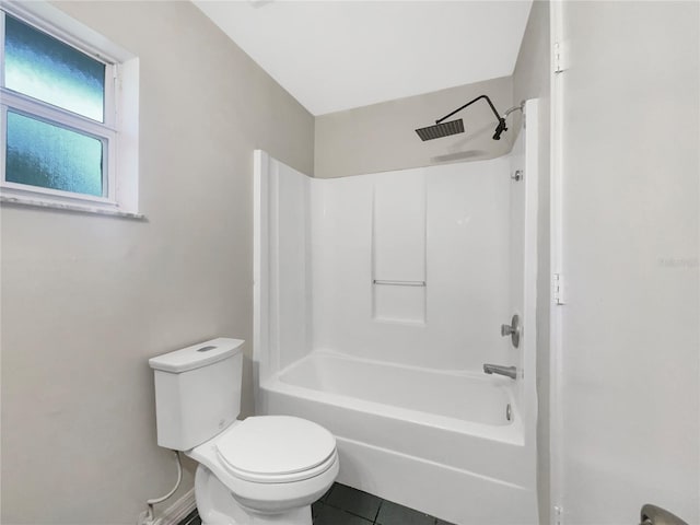 full bathroom with toilet, tile patterned flooring, and bathing tub / shower combination